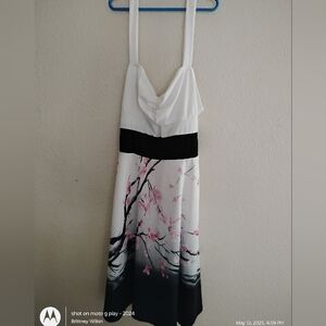 Elegant White and Black Dress with Pink Floral Design